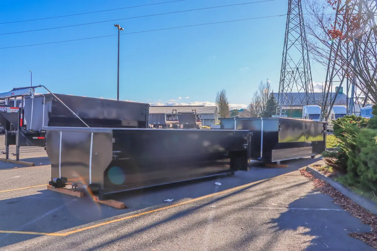 Roll-off dumpster ready for waste disposal at job site for Construction Dumpster Rental in East End